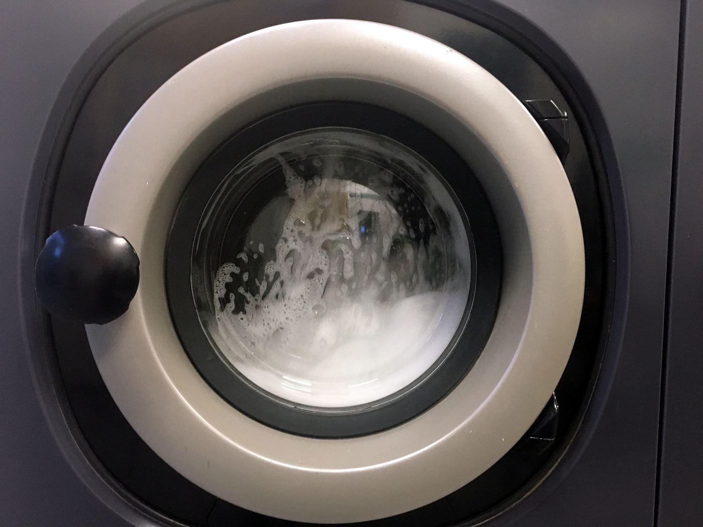 A washing machine mid-cycle — La Laverie de la Somme Washing machine mid-cycle at La Laverie de la Somme, self-service laundrette in Bordeaux Victoire